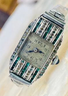 This antique wristwatch from the 1920s is a stunning piece of jewellery that any woman would be lucky to own. Its vintage design and intricate details make it a unique accessory that will surely catch the eye. The watch is made for women and is perfect for adding a touch of elegance to any outfit.  Jewelled crown, beautiful marcasite surrounding the dial Measures 27 x 17mm without lugs and winder One stone missing as per picture but not noticeable  Stainless steel stretch strap Antique Silver Watches With Subdials, Art Deco Watches Ladies, Antique Silver Diamond Watch With Polished Finish, Antique Diamond Watch With Polished Finish, Vintage Ladies Elgin Watch, Stretch Strap, Stretch Band, The 1920s, Women Wrist Watch