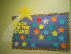 a bulletin board with stars on it and the words reach for the stars written below