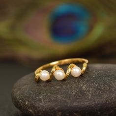 Pearl Wedding Band, Minimalist Delicate Pearl Engagement Ring, 3 Pearl Wrap Bridal Band, Round Cut Pearl Cluster Ring, Promise Ring Gift JUST OPENED- Experience beautiful jewelry that complements your everyday style, and completes your look. Our jewelry is so stunning, and so you  Main Stone : Pearl Main Stone Shape :Round Main Stone Color : White Main Stone Size: 2mm Main Stone Birth : June This ring is one of a kind which is mesmerizing and gives soothing pleasure to eyes. It is made with 925 sterling silver with craftsmanship of utmost quality. This beautiful ring is available in three different colors .The side stones are black spinal which enhances the beauty of ring with their shine. Features: * Handmade * Center Stone Ruby * Brand New * All Ring Sizes Available * Suitable For Every Pearl Wedding Band, Pearl Wedding Bands, Pearl Cluster Ring, Pearl Engagement Ring, Bridal Wrap, Promise Ring Gift, Pearl Cluster, Bridal Bands, Pearl Wedding