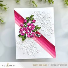 a close up of a greeting card with flowers on the front and bottom corner,