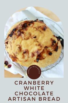 cranberry white chocolate artisan bread on a cooling rack with text overlay