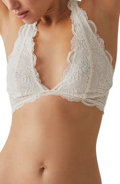 This sultry lace bra is designed in a halter silhouette with sweet scallop trim. Halter neck Partially lined 90% nylon, 10% spandex Hand wash, line dry Imported Delicate Fitted Bra With Delicate Straps, White Fitted Feminine Halter Top, Feminine Stretch Lace Bra, Stretch Lace Trim Bra, Delicate Lace Fitted Bra, Delicate Fitted Lace Bra, Fitted Lace Trim Halter Top, Fitted Lace Bra With Lace Trim, Fitted Low-cut Wedding Bra