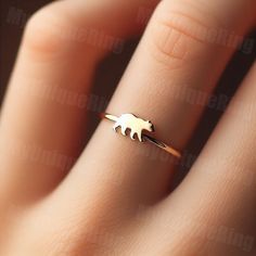 *Free engravings up to 20 characters* 🐻 Step into the wilderness with our Gold Women's Walking Bear Ring! 🌿 👑 Make a statement with this majestic piece, meticulously crafted with precision and passion. Designed for the modern woman who admires the strength and grace of bears. 🌟 🌟 Handcrafted from high-quality 10k gold, this ring features a detailed depiction of a walking bear, capturing the power and beauty of these magnificent creatures in motion. 💫 💖 The bear symbolizes strength, courage, and protection, making this ring a perfect accessory for those who seek resilience and embrace their inner fortitude. 🌸 🎁 Whether it's a treat for yourself or a cherished gift for someone special, this women's walking bear ring is sure to inspire and become a cherished addition to any jewelry c Bear Rings, Bear Ring, Bear Jewelry, Ring Bear, Gold Rings Fashion, Rings Fashion, Jewelry Simple, Ring Minimalist, Ring Dainty