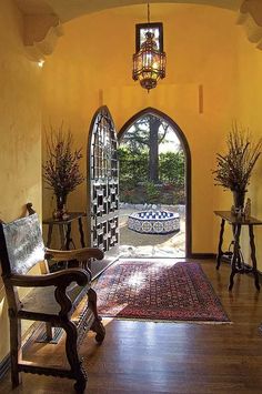 an arched doorway leads to a sitting area