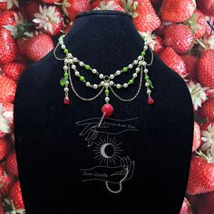 Strawberry Fields beaded choker fairy necklace Made by hand  Bead materials:  - glass - Resin Metals: - stainless steel Nickel free Handmade Fantasy Choker For Festivals, Handmade Fantasy Festival Choker, Handmade Fantasy Choker As Gift, Handmade Fantasy Choker For Gifts, Fantasy Beaded Jewelry As Gift, Handmade Whimsical Choker Jewelry, Fairycore Beaded Jewelry For Festivals, Fairycore Beaded Festival Jewelry, Fairycore Beaded Jewelry Gift