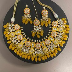 Yellow Kundan Necklace Set with pearls and hand painted meenakari. Sabyasachi inspired necklace set. Statement Necklace Set. Yellow kundan necklace set with earrings and maang tikka. Manish Malhotra necklace set. Sabyasachi jewelry. Indian Necklace Set, Meenakari Necklace, Yellow Necklace, Bangle Ring, Indian Necklace, Maang Tikka, Polki Jewellery, Natural Stone Jewelry, Kundan Necklaces