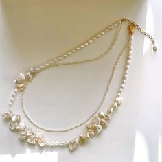 A chic necklace made with high luster freshwater keishi pearls and very rare 1mm diameter pearls. The metal is high-quality 18K gold-filled and won't tarnish and can last for a lifetime. It's a choker/collar necklace that can be adjusted from 14 inches to 15.5 inches long. This piece will be perfectly matched with other longer necklaces and also help with covering the cervical stripe. The pearls are naturally grown, so they are one of a kind and will not be identical. I will handpick the pearls Small Pearl Ring, Unique Pearl Necklace, Cactus Necklace, Choker Collar Necklace, Collar Choker, Chic Necklace, Keshi Pearls, Choker Collar, Multi Strand Necklace