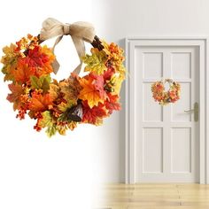 a door with a wreath hanging from it's side next to an open door