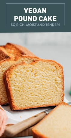 a loaf of vegan pound cake sitting on top of a cutting board next to sliced bread