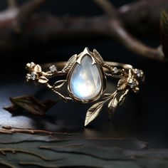 Pear shape moonstone engagement ring Rustic Diamond Engagement Ring, Druid Engagement Ring, Fae Inspired Engagement Rings, Fantasy Rings Engagement, Pagan Engagement Ring, Fairy Wedding Rings, Turquoise Engagement Rings, Moonstone Engagement Rings