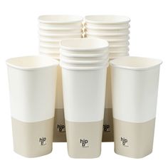 a stack of white cups sitting next to each other