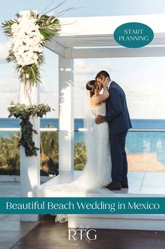 a bride and groom kissing in front of an ocean view wedding venue with the caption beautiful beach wedding in mexico