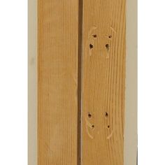 a wooden door with holes in it