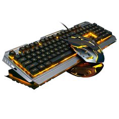 a computer keyboard and mouse with glowing lights