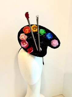 Painters' palette- Artist Headband- unique Fascinator -Rainbow Flowers headband - Hello, This Flower fascinator is made of a black sequins paint palette they have flowers as the colors. It's 9" wide. 2 paint brushes have Crystal on me and to signify paint for a little extra bling.   It's on a 1/2inch wrapped black headband. The headband can fit any head size and is adjustable to fit any size head. Even a big head like my own  I've been making hair pieces over 20 years. I love what I do, and I ho Crazy Hat Day Ideas For Adults, Crazy Hat Day Ideas, Carnival Headpiece, Unique Fascinators, Fascinator Hats Diy, Flowers Headband, Crazy Hat Day, Fashion Flowers, Painters Palette