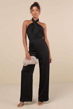 The Lulus Beyond Classy Black Satin Halter Wide-Leg Jumpsuit is perfect for a night of bubbly and dancing! Sleek woven satin shapes this sensational jumpsuit that has a halter neckline (with button closures) and a sleeveless, cross-front bodice with a flirty keyhole cutout at the front and a sexy backless design. The fitted waist tops trendy, wide pant legs that fall to ankle-length hems. Hidden back zipper/clasp. Fit: This garment fits true to size. Length: Floor length. Size medium measures 66 Black Bridesmaid Pantsuit, Fitted Satin Strapless Jumpsuit For Night Out, Elegant Fitted Satin Strapless Jumpsuit, Sleeveless Satin Jumpsuits For Evening, Satin Sleeveless Jumpsuit For Date Night, Sleeveless Satin Jumpsuit For Date Night, Evening Strapless Satin Jumpsuit, Satin Sleeveless Jumpsuits And Rompers For Date Night, Sleeveless Satin Jumpsuits And Rompers For Date Night