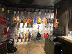 a room with guitars hanging on the wall