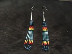 Authentic Beautiful Native American Indian Jewelry Navajo Hand Beaded Long Dangle Earrings. Great for a gift❤️ Handcrafted by Navajo Artist R. Sellers These beautiful earrings are approximately 4.75" in length and 1" in width. Southwestern Style Earrings With Round Beads For Festivals, Southwestern Style Round Bead Earrings For Festivals, Southwestern Beaded Earrings As Gift, Southwestern Style Beaded Earrings As Gift, Southwestern Style Beaded Earrings For Gift, Southwestern Teardrop Beaded Earrings, Southwestern Adjustable Dangling Bead Earrings, Southwestern Style Beaded Drop Earrings, Southwestern Beaded Drop Earrings For Pierced Ears