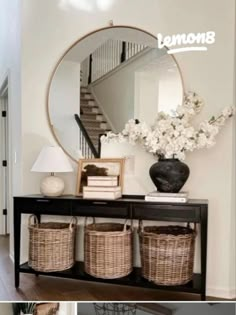 the entryway is decorated in neutral tones and features wicker baskets under a round mirror