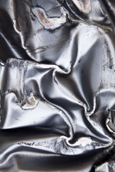 an image of metallic material that looks like it has been made from silver foil and is very