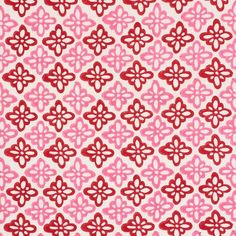 a pink and red pattern on fabric