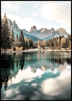 a lake surrounded by mountains and trees