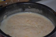 a pot filled with liquid sitting on top of a stove