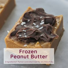 two frozen peanut butter bars with chocolate frosting and sprinkles on top