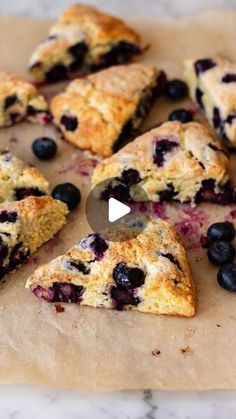 blueberry scones cut into triangles on a piece of parchment paper