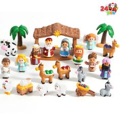 a bunch of toys that are in the shape of a nativity scene with animals and people