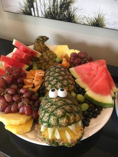 a plate full of different types of fruits and vegetables on it, including watermelon