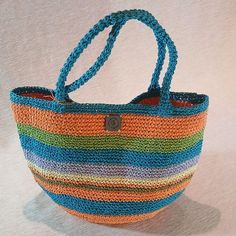 The Perfect Companion for Sunny Days ☀️️ Elevate your style with our handmade crochet tote bag made from natural paper yarn!  Perfect for the beach, picnics, or everyday use, this stylish bag is both lightweight and durable. Its spacious interior allows you to carry your personal belongings and small snacks with ease. A wonderful gift option to make your loved ones happy on special occasions!  Whether it's Mother's Day or Valentine's Day, show your love with this meaningful present. ❤️ Features: Everyday Bohemian Jute Bucket Bag, Bohemian Straw Bag With Adjustable Strap For Everyday Use, Bohemian Natural Bucket Bag For Daily Use, Everyday Bohemian Jute Shoulder Bag, Bohemian Natural Beach Bag For Everyday Use, Bohemian Everyday Jute Shoulder Bag, Bohemian Style Natural Beach Bag, Bohemian Tote Bucket Bag For Daily Use, Bohemian Rectangular Bucket Bag For Daily Use