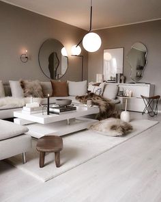 a living room filled with furniture and mirrors