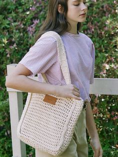 NONLACAL reinterprets the classic mood and pursues a timeless design that can be kept for a long time with a silhouette and sensitive materials that capture natural beauty in everyday life.- Durable 100% cotton used bag- Minimal square shape knit shoulder bag- Includes a set of internal pouches- Wide shoulder strap for a comfortable fit Casual Cream Rectangular Canvas Bag, Casual Beige Cotton Shoulder Bag, Everyday Neutral Cotton Bags, Everyday Natural Canvas Bag For Spring, Casual Cotton Bags For Day Out, Casual Cotton Bag For Day Out, Cream Crochet Tote Bag For Day Out, Natural Cotton Bag With Adjustable Strap, Woven Cotton Shoulder Bag For Spring