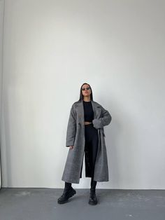 Step out in style with our Vintage Style Grey Classic Trench Coat, designed for the modern woman who appreciates both comfort and elegance. This long trench winter coat is crafted from high-quality vegan wool, ensuring warmth and durability for those chilly days. Featuring an oversized fit, this coat allows for easy layering over your favorite outfits, making it a versatile addition to your winter wardrobe.  Perfect for any occasion, this coat for women is not just about functionality; it's a fa Oversized Gray Sweater Coat For Work, Oversized Gray Wool Coat With Long Sleeves, Oversized Gray Long Sleeve Wool Coat, Trendy Oversized Pea Coat For Winter, Oversized Trendy Winter Pea Coat, Oversized Gray Wool Coat For Fall, Gray Oversized Wool Coat For Fall, Oversized Solid Wool Coat For Cold Weather, Oversized Wool Coat For Cold Weather