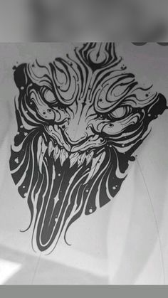 a black and white drawing of a wolf's head on a piece of paper