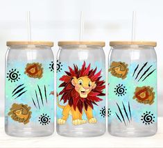 three glass jars with lion designs on them