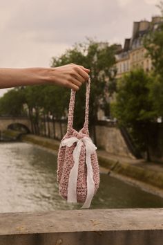 Our Celeste Bag is elegantly crafted to inspire versatile styling, day or night. Featuring a luxurious combination of Donegal wool tweed and mulberry silk, completed with a drawstring closure and a short handle for easy wearing. We adore the vintage-inspired 'bucket' style of the Celeste bag for its timeless appeal. COMPOSITION: Bag: 85% Fine highland wool, 15% Donegal Detailing: 100% Mulberry silk charmeuse This style is unlined. Made to order. Everyday Bucket Crochet Bag With Dust Bag, Everyday Use Crochet Bucket Bag With Dust Bag, Bucket Crochet Bag With Dust Bag, Elegant Everyday Crochet Bucket Bag, Elegant Crochet Bucket Bag With Leather Handles, Evening Woven Bucket Bag, Woven Evening Bucket Bag, Elegant Bucket Crochet Bag For Daily Use, Elegant Crochet Bucket Bag For Daily Use