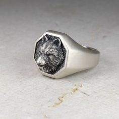 ✪This beautiful Ring comes with The final Look as Matt Surface or Polished Surface, the Icon is Matt Surface in both choices ✪ Item Details ✪ ✪ The weight of this Ring is +-18.0 gr. ✪ Pendant Materials: Solid Sterling Silver 925 ✪ Wolf Head Materials: Bronze or Silver 925 📐 Dimensions 18 mm x 18 mm ~ 0.71 x 0.71 inches wide at the top ✪ Designed & created by Vartovar Jewelry (Hand-Finished) ✪ Shipping with tracking number is available →If you want to buy Wolf Head Brooch Pin ⤵️→Use this link →h Collectible Nickel Free Sterling Silver Signet Ring, Silver Carved Sterling Silver Signet Ring, Carved Sterling Silver Signet Ring Gift, Symbolic Carved Sterling Silver Signet Ring, Silver Carved Signet Ring Gift, Wolf Design Ring Jewelry For Gift, Wolf Rings, Wolf Signet Ring, Wolf Design Ring Jewelry Gift