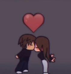 two people are kissing in front of a heart