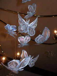 some glass butterflies hanging from a wire