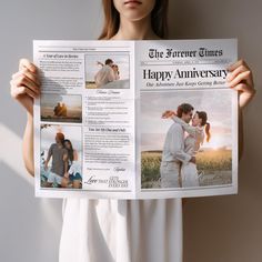 a woman holding up a newspaper with photos on it