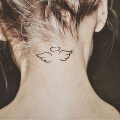 a woman with a small tattoo on her neck