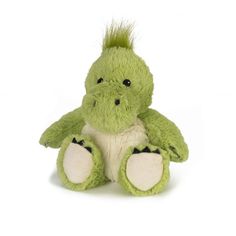 a green stuffed animal sitting on top of a white floor