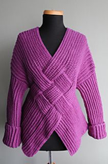 a woman's purple sweater is shown on a mannequin