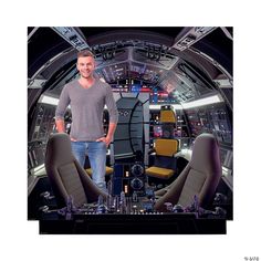 a man standing in the cockpit of a spaceship