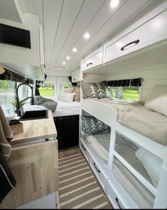 the interior of a camper with bunk beds