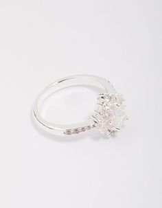 a white gold ring with an oval cut diamond