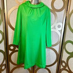 Vintage Puritan Forever Young 1970s collared A-Line dress in a gorgeous green color. This dress is in excellent condition! There is no size listed but I tried it on and it fits like a L/XL (I wear a medium).  There is no material tag but it feels like a polyester knit.   Measurements:  Chest: 42" Length: 38" Waist: 37" Hips: Free Bottom: 32" Sleeves: 23 1/2" Comes from a smoke free, pet friendly home. Green Vintage Dress For Fall, Vintage Green Collared Dress, 1970s Green Long Sleeve Dress, 1970s Style Green Long Sleeve Dress, Green Long Sleeve Vintage Dress For Party, Green Long Sleeve Vintage Party Dress, Dress Retro, Retro Clothing, Forever Young