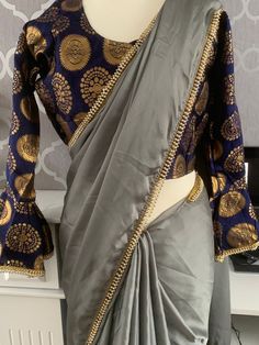 Satin Saree Grey & Navy with brocade ready blouse 40" Fitted Long Sleeve Pre-draped Saree For Eid, Diwali Georgette Tops With Zari Work, Festive Georgette Blouse With Zari Work, Brocade Pre-draped Saree With Unstitched Blouse, Semi-stitched Brocade Blouse For Wedding, Semi-stitched Brocade Wedding Blouse, Designer Dola Silk Blouse For Eid, Festive Designer Georgette Blouse, Elegant Brocade Pre-draped Saree With Unstitched Blouse